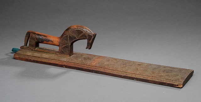 Danish mangling board with a stylized horse, dated 1774